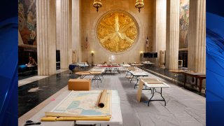 Salvaged historical items are laid out to dry in the Great Hall in the Hall of State building at Fair Park in Dallas.(Tom Fox / Staff Photographer)