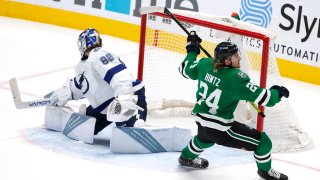 Dallas Stars left wing Roope Hintz (24) turns after scoring against Tampa Bay Lightning goaltender Andrei Vasilevskiy (88) during the third period of an NHL hockey game in Dallas, Thursday, March 25, 2021.