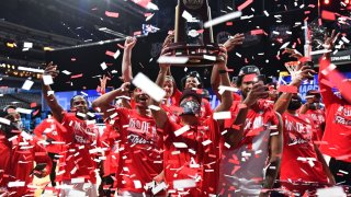 The Houston Cougars celebrate their victory over the Oregon State Beavers in the Elite Eight round of the 2021 NCAA Division I Men's Basketball Tournament held at Lucas Oil Stadium on March 29, 2021 in Indianapolis, Indiana.