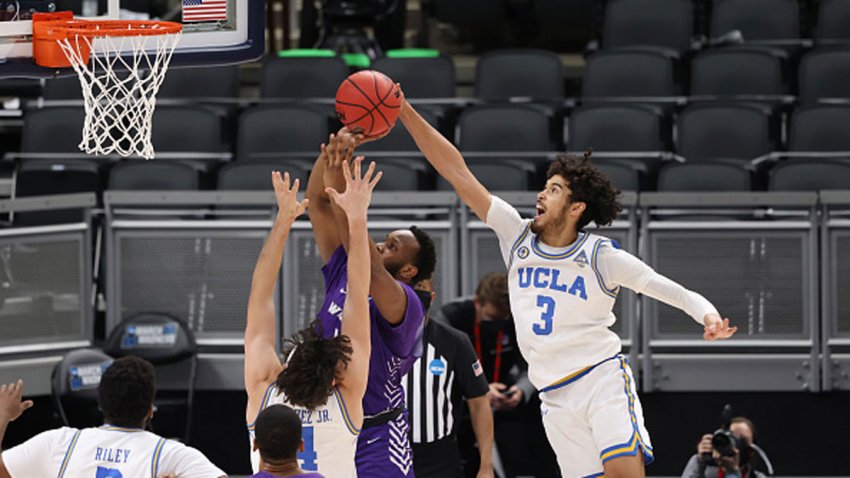 Johnny Juzang #3 of the UCLA Bruins blocks a shot against the Abilene Christian Wildcats in the second round of the 2021 NCAA Division I Men's Basketball Tournament held at Bankers Life Fieldhouse on March 22, 2021 in Indianapolis, Indiana.