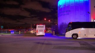 Several buses arrived at the Kay Bailey Hutchison Convention Center late Wednesday in Dallas under escort by federal vehicles.