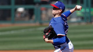 Starting pitcher Kyle Gibson #44 of the Texas Rangers pitches against the San Francisco Giants during the first inning of the MLB spring training game on March 1, 2021 in Surprise, Arizona.