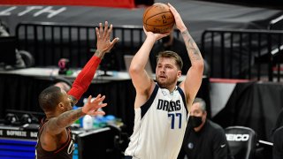 Luka Doncic #77 of the Dallas Mavericks shoots the ball during an NBA game against the Portland Trail Blazers at Moda Center on March 21, 2021 in Portland, Oregon.