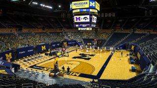 The Michigan Wolverines warm up before a game against the Iowa Hawkeyes at Crisler Arena on Feb. 25, 2021 in Ann Arbor, Michigan.
