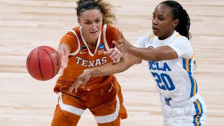 UCLA guard Charisma Osborne (20) passes under pressure from Texas guard Celeste Taylor during the first half of a college basketball game in the second round of the women's NCAA tournament at the Alamodome in San Antonio, Wednesday, March 24, 2021.