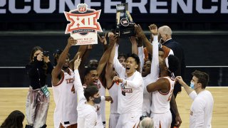 The Texas Longhorns celebrate after defeating the Oklahoma State Cowboys 91-86 to win the Big 12 Basketball Tournament championship game at the T-Mobile Center on March 13, 2021 in Kansas City, Missouri.