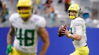 Quarterback Tyler Shough #12 of the Oregon Ducks drops back to pass during the first half of the PlayStation Fiesta Bowl against the Iowa State Cyclones at State Farm Stadium on Jan. 2, 2021 in Glendale, Arizona. The Cyclones defeated the Ducks 34-17.