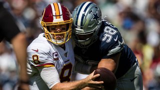 Tyrone Crawford #98 of the Dallas Cowboys sacks Case Keenum #8 of the Washington Redskins during the first half at FedExField on Sept. 15, 2019 in Landover, Maryland.