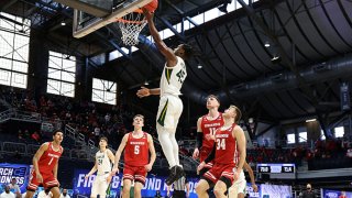 Davion Mitchell #45 of the Baylor Bears goes for a lay-up during the second half against the Wisconsin Badgers in the second round game of the 2021 NCAA Men's Basketball Tournament at Hinkle Fieldhouse on March 21, 2021 in Indianapolis, Indiana.