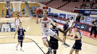 Mac McClung #0 of the Texas Tech Red Raiders drives to the basket during the first half against the Utah State Aggies in the first round game of the 2021 NCAA Men's Basketball Tournament at Assembly Hall on March 19, 2021 in Bloomington, Indiana.