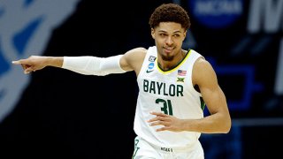 MaCio Teague #31 of the Baylor Bears reacts after a play against the Hartford Hawks in the first round game of the 2021 NCAA Men's Basketball Tournament at Lucas Oil Stadium on March 19, 2021 in Indianapolis, Indiana.