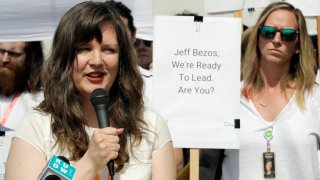 FILE - Emily Cunningham, left, speaks as Kathryn Dellinger, right, looks on during a news conference following Amazon's annual shareholders meeting, Wednesday, May 22, 2019, in Seattle. The National Labor Relations Board has found that two outspoken Amazon workers were illegally fired last year. Both employees, Emily Cunningham and Maren Costa, worked at Amazon offices in Seattle and publicly criticized the company, pushing it to do more to reduce its impact on climate change and to better protect warehouse workers from the coronavirus. The NLRB confirmed Monday, April 5, 2021 that it found merit in the case.