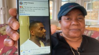 Glenda Brown Thomas displays a photo of her nephew, Andrew Brown Jr., on her cell phone at her home in Elizabeth City, N.C.