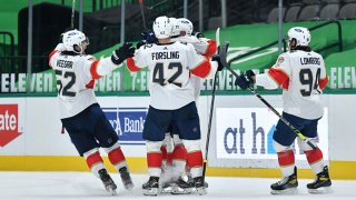 Gustav Forsling #42 and the Florida Panthers celebrate an overtime win against the Dallas Stars at the American Airlines Center on April 13, 2021 in Dallas, Texas.