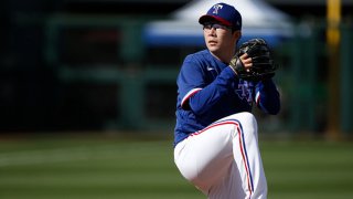 Pitcher Hyeon-jong Yang #68 of the Texas Rangers throws against the Los Angeles Dodgers during the eighth inning of the MLB spring training baseball game at Surprise Stadium on March 7, 2021 in Surprise, Arizona.