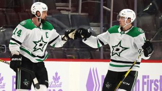 Jamie Benn #14 of the Dallas Stars celebrates his game winning overtime goal with Miro Heiskanen while playing the Detroit Red Wings at Little Caesars Arena on April 24, 2021 in Detroit, Michigan.