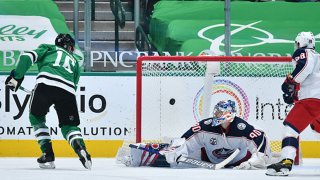 Joe Pavelski #16 of the Dallas Stars flips in a goal against Elvis Merzlikins #90 of the Columbus Blue Jackets at the American Airlines Center on April 15, 2021 in Dallas, Texas.
