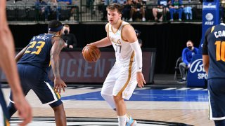 Luka Doncic #77 of the Dallas Mavericks dribbles the ball against the Utah Jazz on April 5, 2021 at the American Airlines Center in Dallas, Texas.