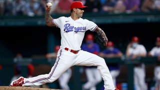 Matt Bush #51 of the Texas Rangers pitches against the Toronto Blue Jays in the top of the eighth inning at Globe Life Field on April 6, 2021 in Arlington, Texas.