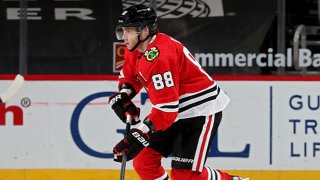 Patrick Kane #88 of the Chicago Blackhawks skates with the puck in the third period against the Dallas Stars at the United Center on April 6, 2021 in Chicago, Illinois.
