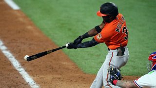 Cedric Mullins #31 of the Baltimore Orioles hits an RBI single in the seventh inning against the Texas Rangers during the MLB game at Globe Life Field on April 17, 2021 in Arlington, Texas.