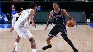 De'Aaron Fox #5 of the Sacramento Kings dribbles the ball during the game against the Dallas Mavericks on April 18, 2021 at the American Airlines Center in Dallas, Texas.