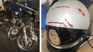 Picture of the police officers motorcycle and helmet after the collision