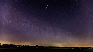 A meteor of the lyrids in the sky is seen on April 22, 2020 in Schermbeck, Germany.