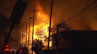 A large fire Saturday night destroyed four Old East Dallas apartment buildings that were under construction, officials say.