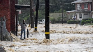 Flood waters stream down the road in Muhlenberg Township, Pennsylvania, after a major storm last August.