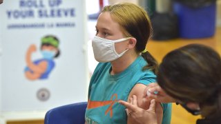 A student gets her first Pfizer Biontech COVID vaccine at Ridley High School, May, 3, 2021 as part of a clinic for students age 16-18.