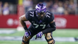 TCU Horned Frogs offensive tackle Lucas Niang (#77) prepares for the snap during the Advocare Showdown college football game between the Ohio State Buckeyes and the TCU Horned Frogs on September 15, 2018 at AT&T Stadium in Arlington, Texas. Ohio State won the game 40-28.