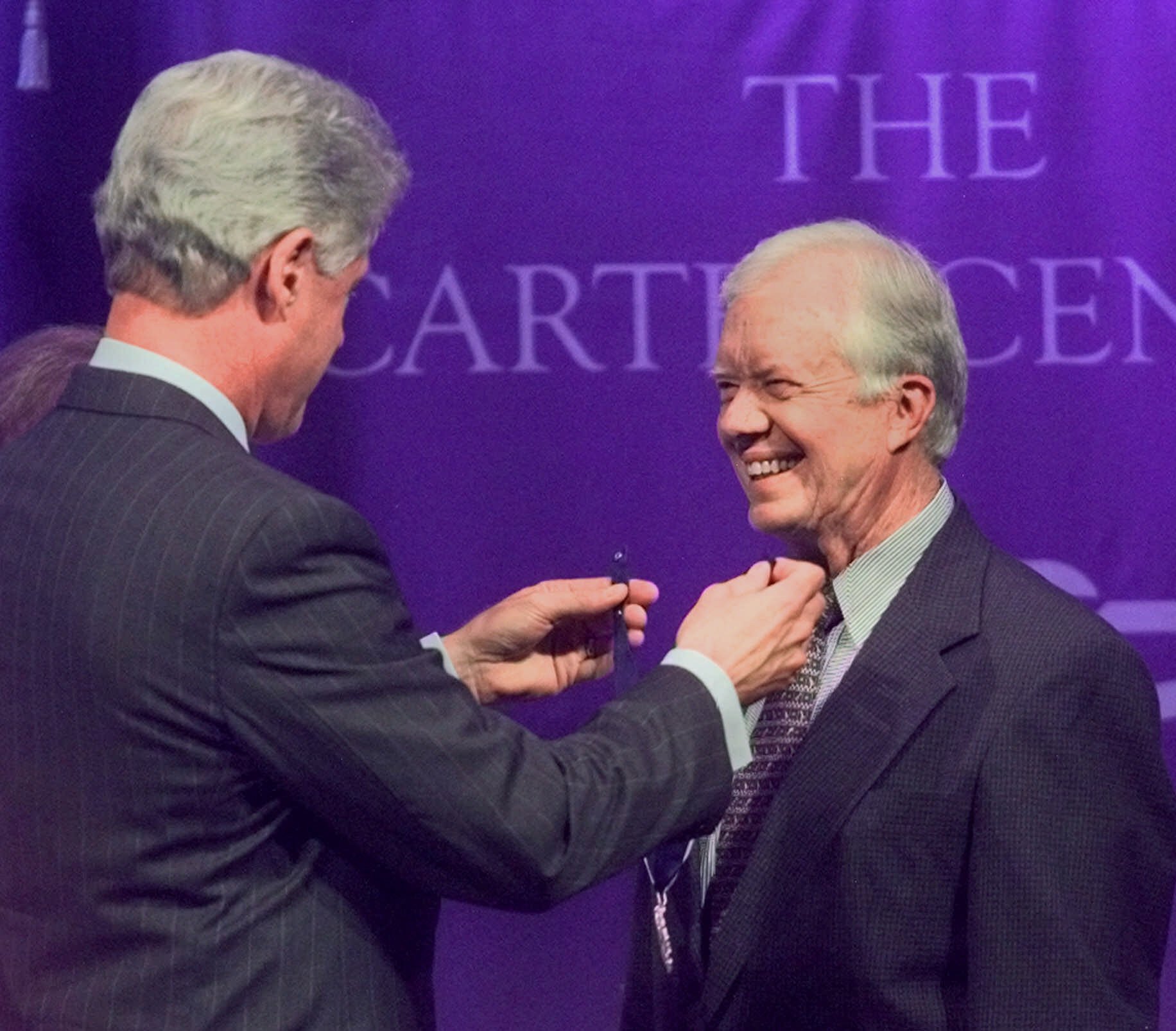 President Bill Clinton presents former President Jimmy Carter, right, with the  Presidential Medal of Freedom, the nation’s highest civilian honor, during a ceremony at the Carter Center in Atlanta Monday, Aug. 9, 1999.