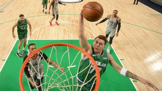 Luka Doncic #77 of the Dallas Mavericks dunks the ball during the game against the Washington Wizards on May 1, 2021 at the American Airlines Center in Dallas, Texas.