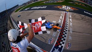 Scott Dixon of New Zealand, driver of the #9 PNC Bank Chip Ganassi Racing Honda, takes the checkered flag to win the NTT IndyCar Series Genesys 300 at Texas Motor Speedway on May 1, 2021 in Fort Worth, Texas.