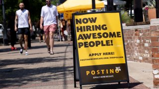 A now hiring sign outside of Position in Deep Ellum on Saturday, May 15, 2021, in Dallas.