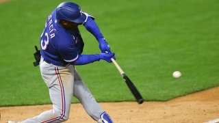 Adolis Garcia #53 of the Texas Rangers hits a two run home run in the ninth inning against the Minnesota Twins at Target Field on May 4, 2021 in Minneapolis, Minnesota.