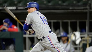 Brock Holt #16 of the Texas Rangers bats against the Chicago White Sox on April 23, 2021 at Guaranteed Rate Field in Chicago, Illinois.