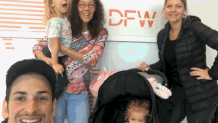 Barbara Potter holding one of her two grandchildren along with her daughter and son-in-law.