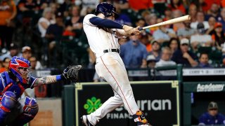 Kyle Tucker #30 of the Houston Astros hits a two-run home run in the seventh inning against the Texas Rangers at Minute Maid Park on May 15, 2021 in Houston, Texas.