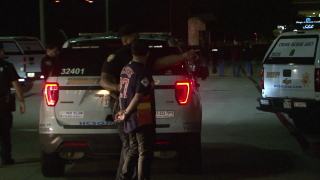 One woman died and several other people were injured when a driver struck a group of people in the parking lot of a suburban Houston restaurant following a reported fight early Thursday, police said.