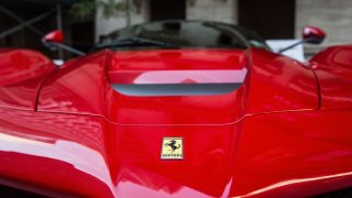 A Ferrari is parked outside the New York Stock Exchange in celebration of Ferrari Automotive Company’s IPO on October 21, 2015 in New York City.