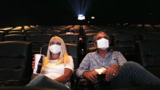 Patrons watch a movie at AMC DINE-IN Thoroughbred 20 on August 20, 2020 in Franklin, Tennessee.
