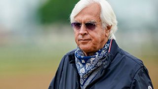 Bob Baffert, trainer of Kentucky Derby winner Medina Spirit, stands near the track at Churchill Downs in Louisville, Kentucky, April 28, 2021.