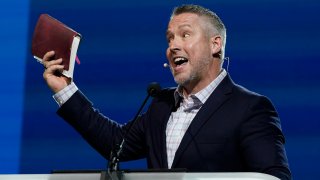Southern Baptist Convention President J. D. Greear holds a Bible
