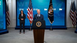 Vice President Kamala Harris listens as President Joe Biden speaks about the COVID-19 vaccination program, in the South Court Auditorium on the White House campus, Wednesday, June 2, 2021, in Washington.