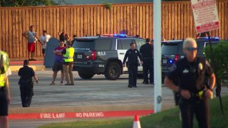 Arlington police say a 16-year-old was shot and killed Wednesday evening near the entrance of Hurricane Harbor water park.