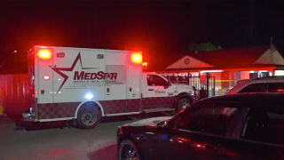 Ambulance at the scene of fatal motel shooting.