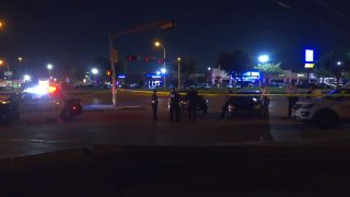 Officers were flagged down at about 1:43 a.m. in the 10100 block of Harry Hines Boulevard, where two people had been shot.