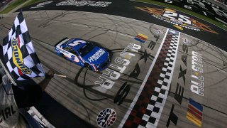 Kyle Larson, driver of the #5 HendrickCars.com Chevrolet, takes the checkered flag to win the NASCAR All-Star Race at Texas Motor Speedway on June 13, 2021 in Fort Worth, Texas.